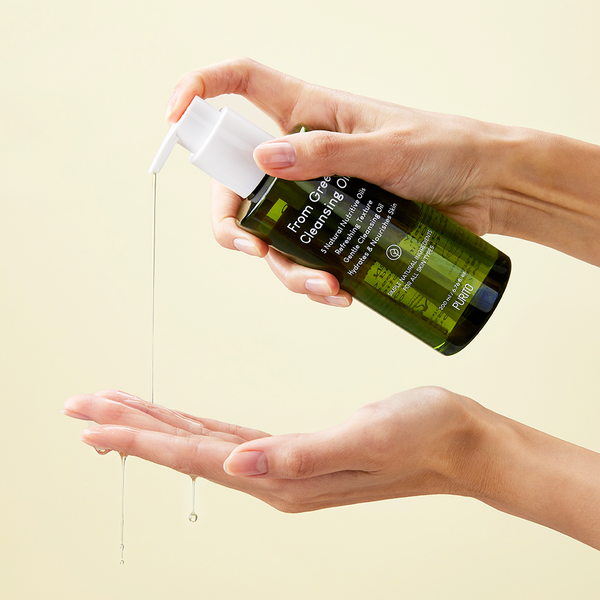 Purito From Green Cleansing Oil bottle with green label, displayed on a white background, showing the product's packaging.