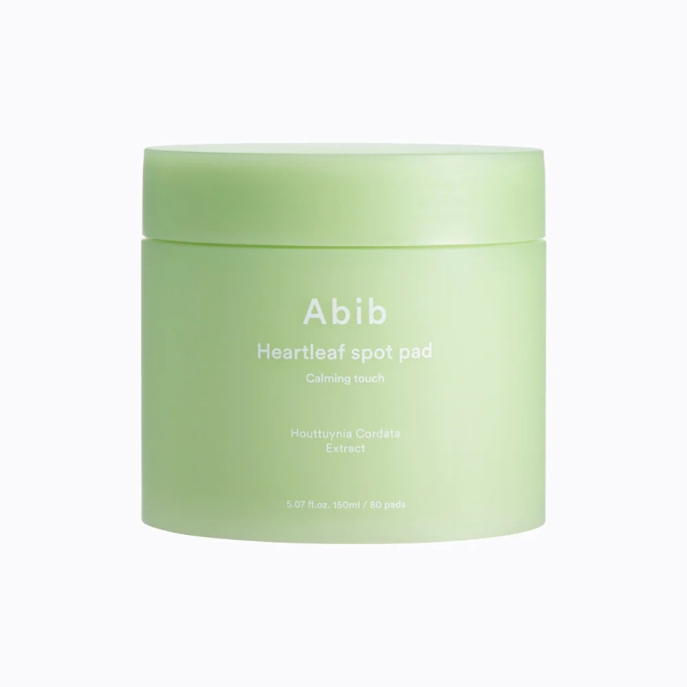 Abib Heartleaf Spot Pad Calming Touch by SELENAIRE, close-up of 80 soothing skincare pads with heartleaf extract.