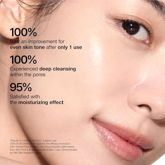 Selenaire Anua Rice Enzyme Brightening Cleansing Powder in a clear jar with a white scoop and rice enzyme particles visible inside.