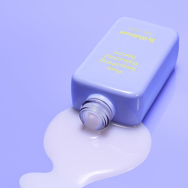 Selenaire By Wishtrend Pore Smoothing Bakuchiol Serum in a clear dropper bottle with serum drops on the surface.