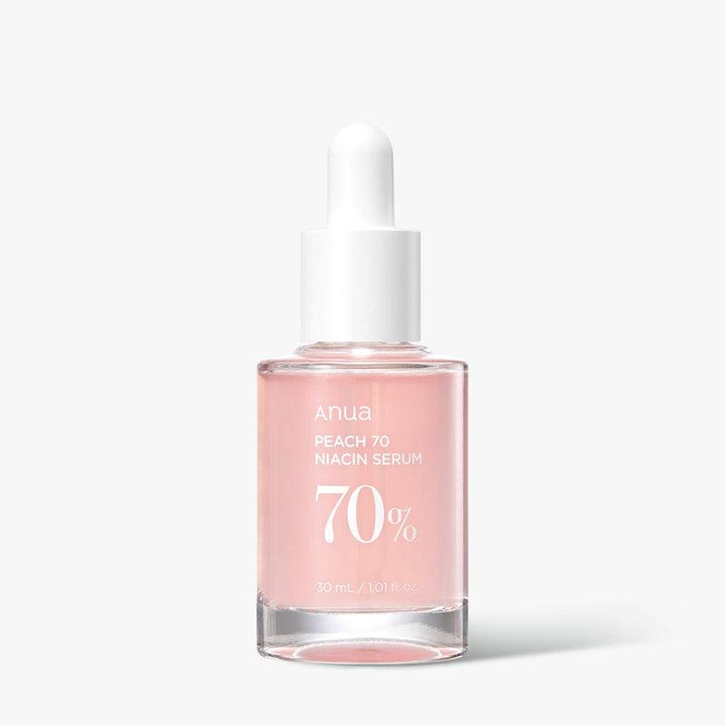Selenaire Anua Peach 70% Niacinamide Serum bottle with orange cap and label, showcasing the skincare product.