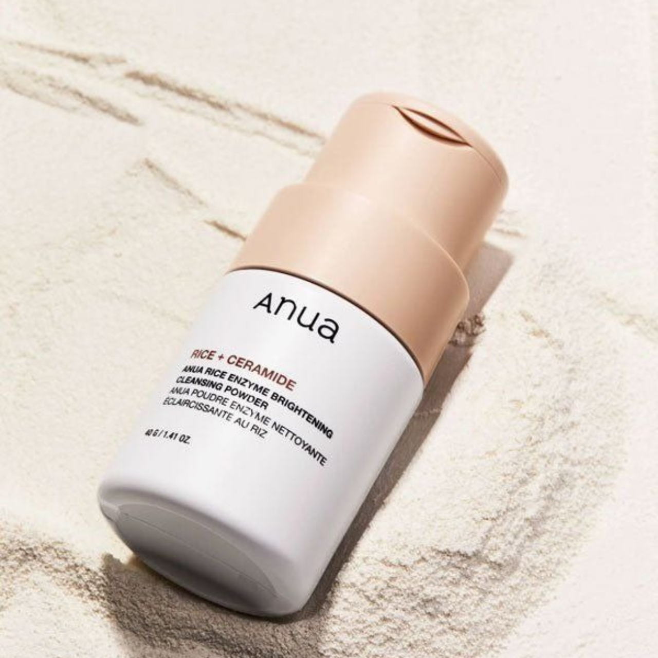 Selenaire Anua Rice Enzyme Brightening Cleansing Powder in a white jar with a clear lid, showing the product label and powder inside.
