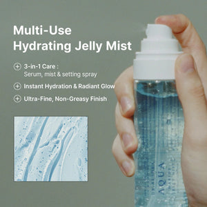 Hand holding a bottle of Aqua Multi-Use Hydrating Jelly Mist with product details on a gray background.