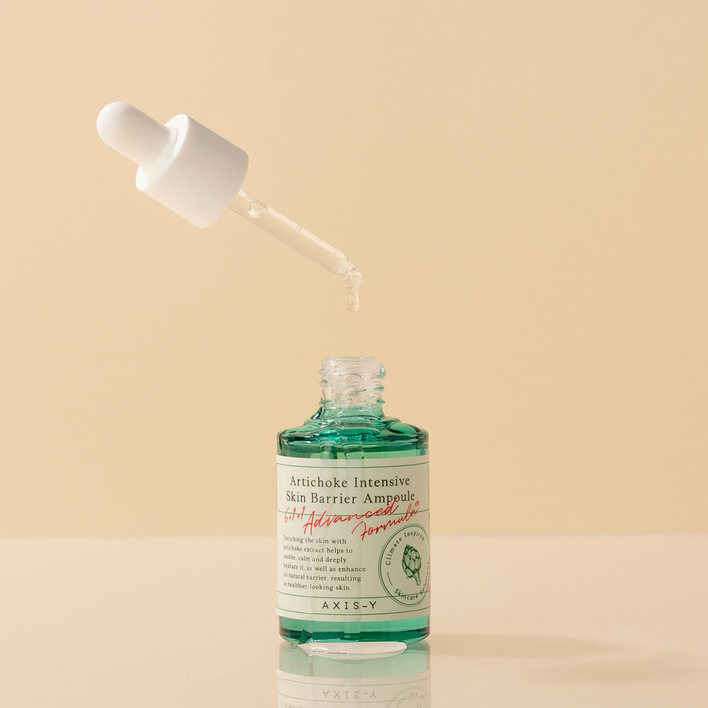 Selenaire AXIS-Y Artichoke Intensive Skin Barrier Ampoule in a clear glass bottle with dropper, showcasing nourishing skincare.