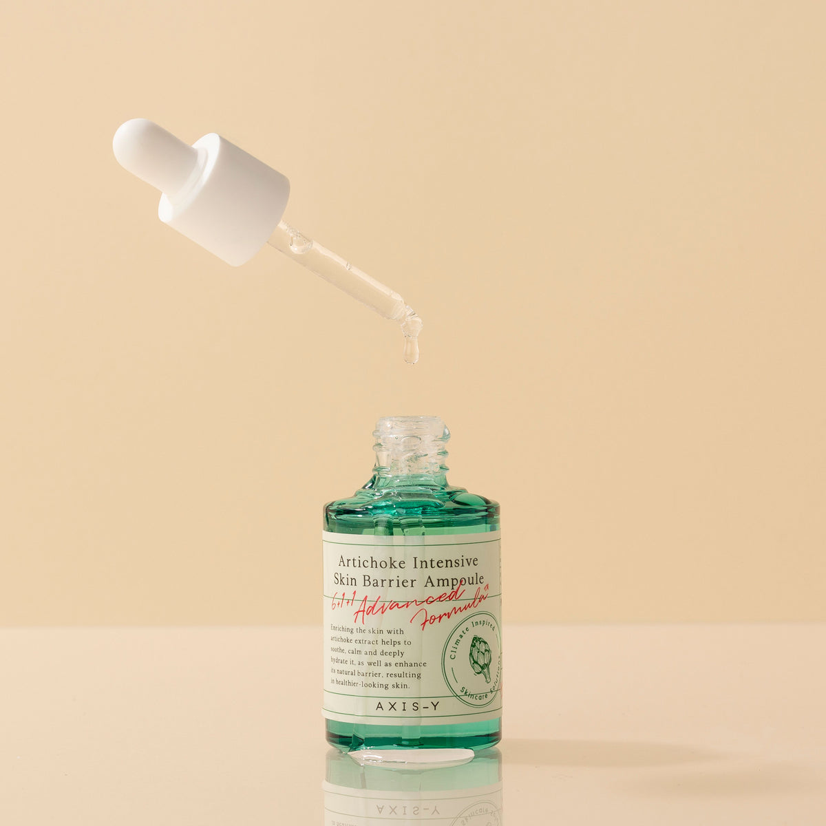 Selenaire AXIS-Y Artichoke Intensive Skin Barrier Ampoule in a clear glass bottle with dropper, showcasing nourishing skincare.