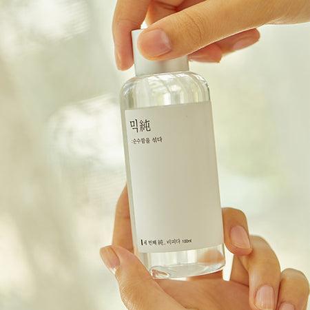 Bottle of Mixsoon Bifida Ferment Essence by Selenaire with clear label, featuring a sleek design and transparent packaging.