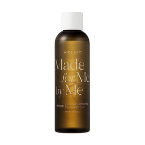 Selenaire AXIS-Y Biome Comforting Infused Toner bottle with clear liquid and botanical ingredients, designed for soothing skincare.