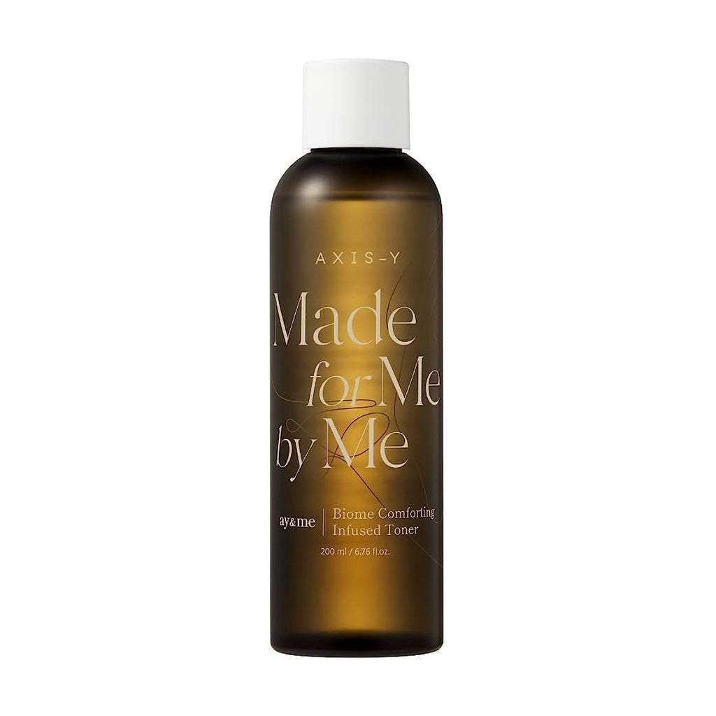 Selenaire AXIS-Y Biome Comforting Infused Toner bottle with clear liquid and botanical ingredients, designed for soothing skincare.