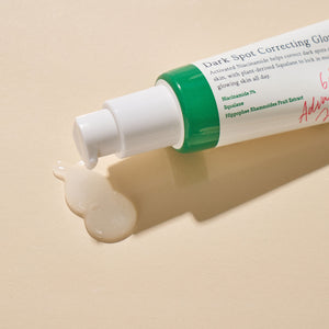 Selenaire AXIS-Y Dark Spot Correcting Glow Serum in a clear glass bottle with dropper, showcasing the product's packaging and branding.