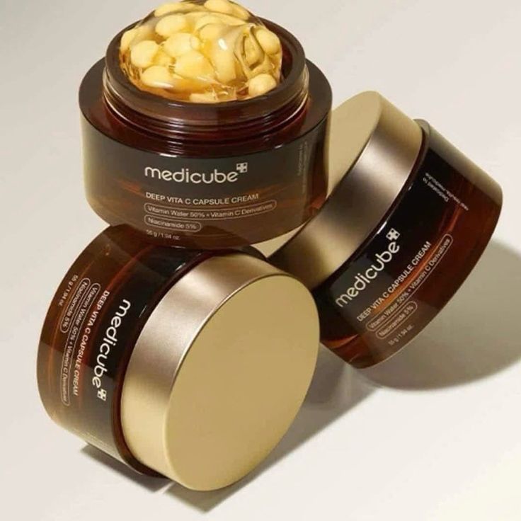 SELENAIRE Medicube Deep Vita C Capsule Cream jar showing vibrant orange capsules and sleek packaging, ideal for brightening skin.
