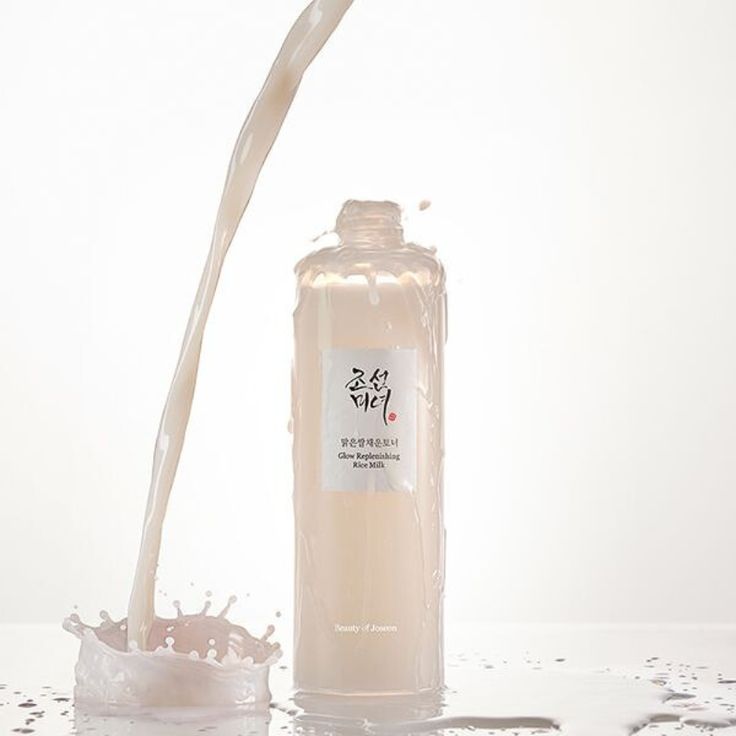 Beauty of Joseon Glow Replenishing Rice Milk bottle with label, skincare product in a clear glass container with white and gold accents.