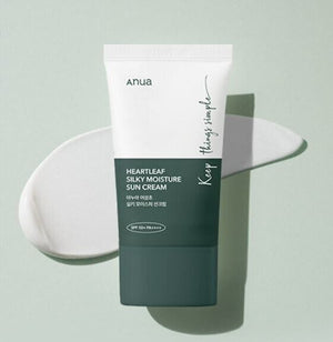 Selenaire Anua Heartleaf Silky Moisture Sunscreen in a white tube with green accents, showing the product label and cap.