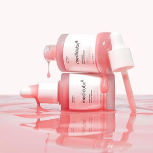 Medicube PDRN Pink Peptide Serum bottle with pink and white packaging, featuring the product label and dropper applicator.