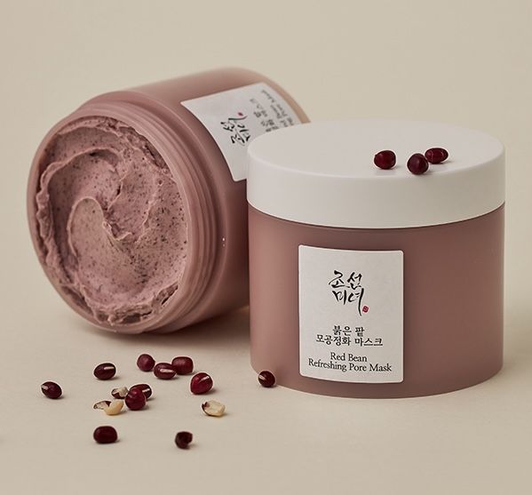 Beauty of Joseon Red Bean Refreshing Pore Mask from SELENAIRE, showing a person with face immersed in a cleansing mask.