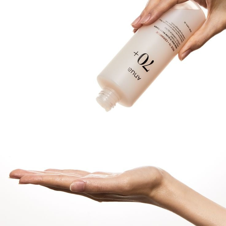 Selenaire Anua Rice 70 Glow Milky Toner bottle with a white cap and label, set against a neutral background.