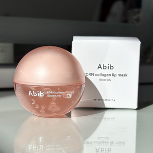 Abib PDRN Collagen Lip Mask Glazed Jelly by SELENAIRE showing a translucent, glossy lip mask in a jar with a pink tint.