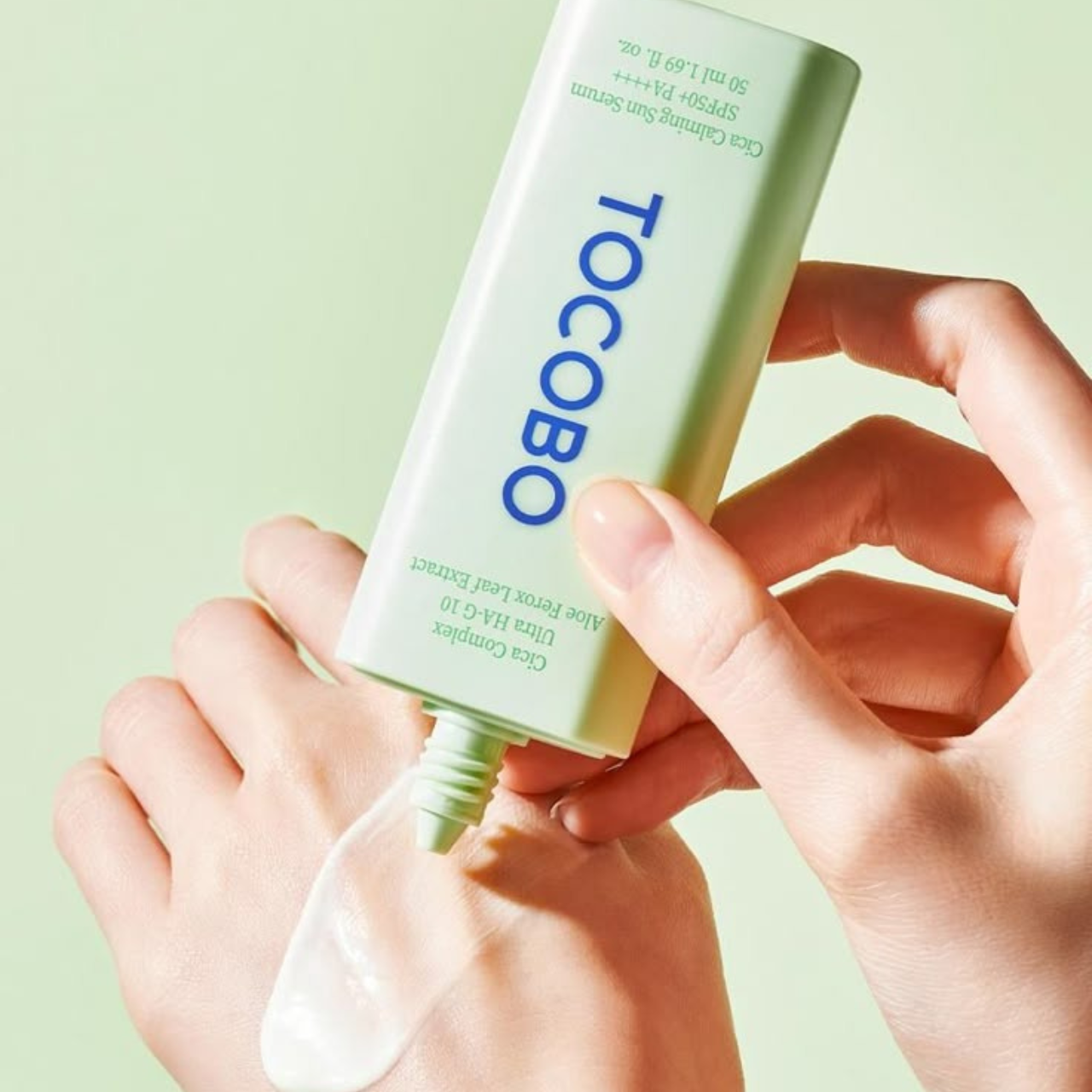 Tocobo Cica Calming Sun Serum by SELENAIRE in a sleek bottle, with a dropper applicator and calming skincare ingredients visible.
