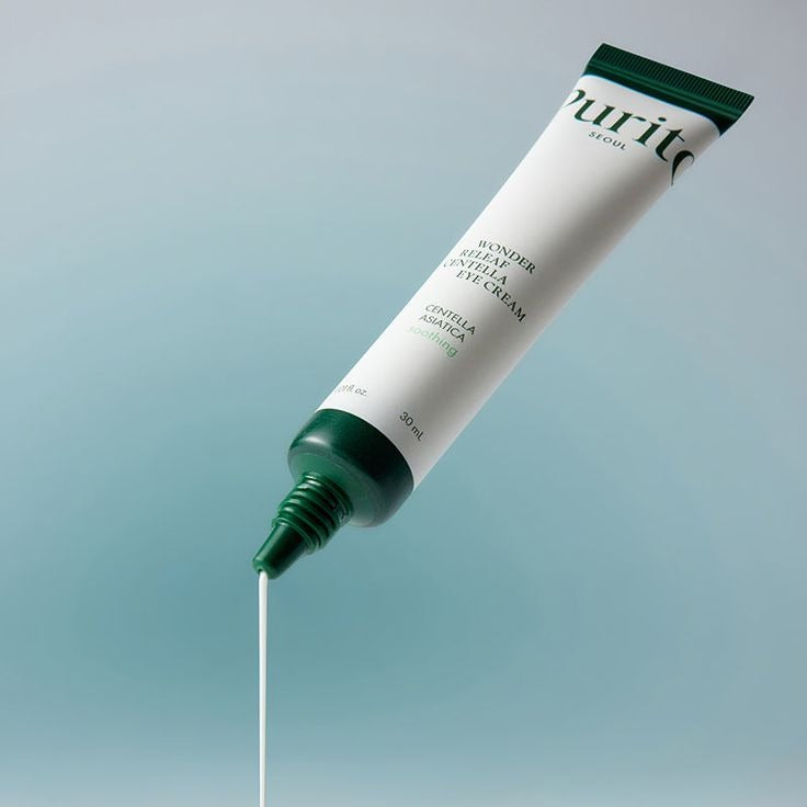 Purito Wonder Releaf Centella Eye Cream jar with a white and green label, displayed on a neutral background.