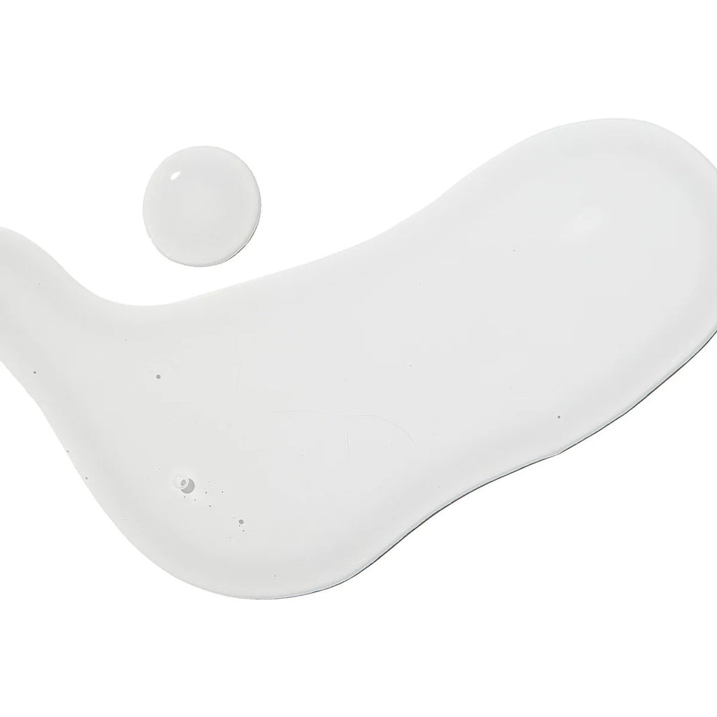 VT Cosmetics Snail Reedle Shot 100B in a clear bottle with a dropper, designed for skincare, branded by SELENAIRE.