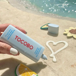 Tocobo Bio Watery Sun Cream SPF 50 by Selenaire, showing the lightweight, hydrating sunscreen in a sleek tube.